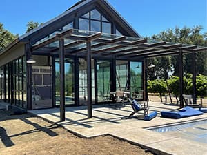 Completed exterior of an HOA community clubhouse with poolside access, built by Jeff Smith Construction in El Dorado Hills, CA.