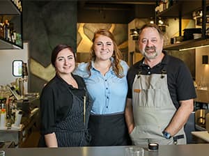 Restaurant staff working inside a finished dining space constructed by Jeff Smith Construction in Folsom, CA.