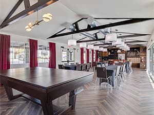 Interior of an HOA clubhouse featuring tables, chairs, and event space constructed by Jeff Smith Construction in Granite Bay, CA.