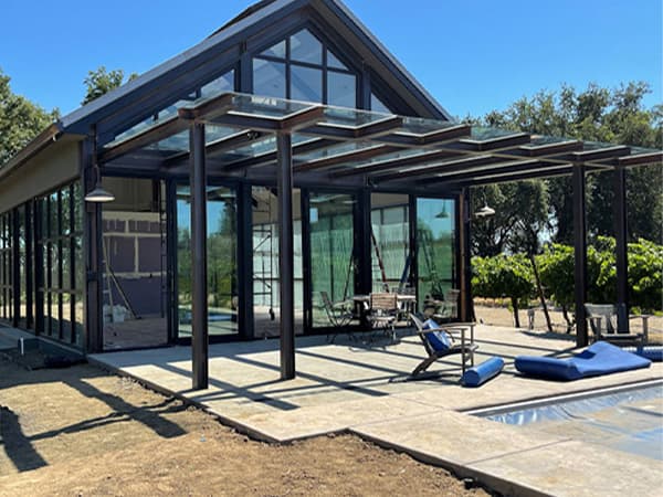 Completed exterior of an HOA community clubhouse with poolside access, built by Jeff Smith Construction in El Dorado Hills, CA.