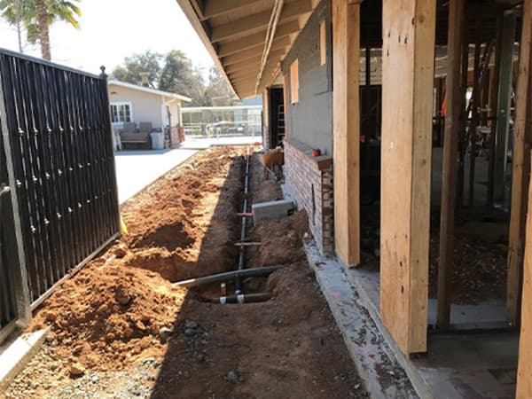 Side view of a commercial building interior showing steel and wooden framing during tenant improvement work in Loomis, CA.