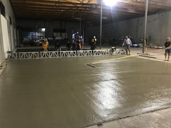 Split image showing Jeff Smith Construction crew flattening freshly poured concrete and building wooden plank structures for an axe-throwing bar project in Rocklin, CA.