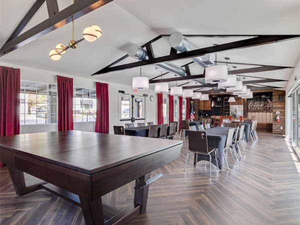 Interior of an HOA clubhouse featuring tables, chairs, and event space constructed by Jeff Smith Construction in Granite Bay, CA.